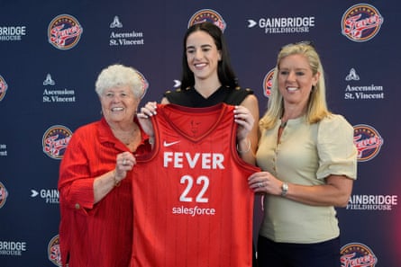 Indiana Fever guard Caitlin Clark, middle, poses with general manager Lin Dunn, left, and head coach Christie Sides following her introductory news conference on Wednesday.