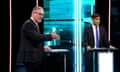 Labour party leader Keir Starmer  and prime minister Rishi Sunak speak on stage during the first head-to-head debate of the General Election on June 4, 2024 in Salford, England