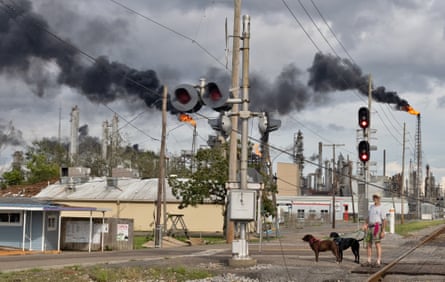 Peter Anderson walks his rescue dogs, Phoebe and Joe, near the Shell Norco manufacturing complex.