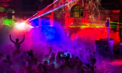 People in the pool with disco lights at a Sparty event at Széchenyi bath, Budapest.