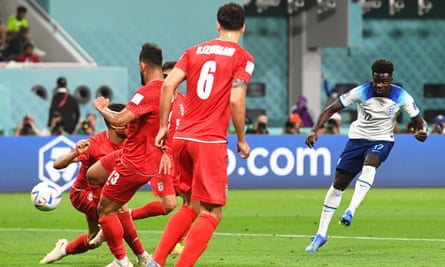 Bukayo Saka watches as his shot finds the net for his second and England’s fourth goal against Iran.