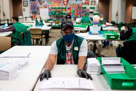 Election judges verify and count ballots at the Denver Elections Division building on November 3, 2020 in Denver, Colorado.