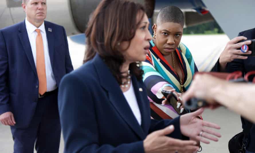 Kamala Harris speaks to reporters as Symone Sanders looks on. Earlier this month it was reported that Sanders is leaving Harris’ office.