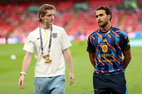 Anthony Gordon of England and SpainâÂÂs Eric GarcÃÂa talk before kick-off.