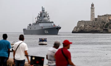 CUBA-RUSSIA-WARSHIPS<br>People look at the class frigate Admiral Gorshkov, part of the Russian naval detachment visiting Cuba, arriving at Havana's harbour, June 12, 2024. The Russian nuclear-powered submarine Kazan -- which will not be carrying nuclear weapons -- and three other Russian naval vessels, will dock in the Cuban capital from June 12-17. The unusual deployment of the Russian military so close to the United States -- particularly the powerful submarine -- comes amid major tensions over the war in Ukraine, where the Western-backed government is fighting a Russian invasion. (Photo by ADALBERTO ROQUE / AFP) (Photo by ADALBERTO ROQUE/AFP via Getty Images)