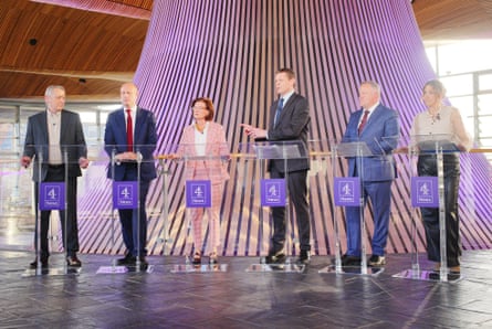 Leaders of Welsh parties stand in a row in part of the Senedd building in Cardiff