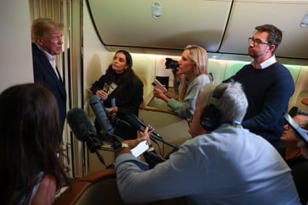 Donald Trump speaks to reporters on Air Force One on the way home from Ireland.