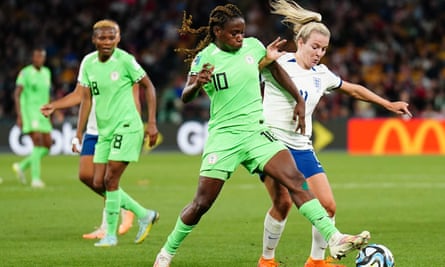 Nigeria’s Christy Ucheibe competes for the ball against England