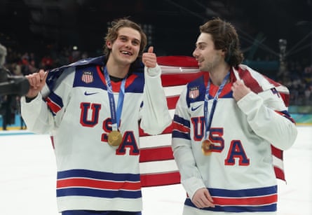 Jack and Quinn Hughes celebrate their team’s victory on Sunday.