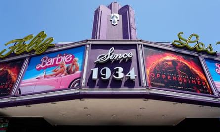 Barbie and Oppenheimer on a cinema billboard.