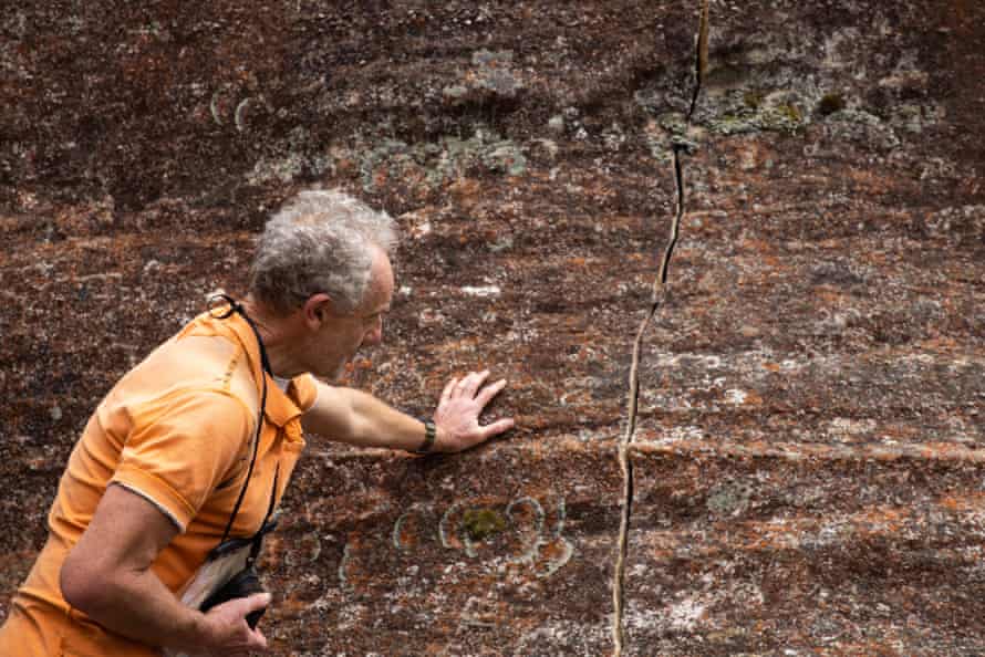 Morning mail: Coalition senators join calls for Covid inquiry, tensions over Russia, fears for fish stocks | Australia news 3 Yuri Bolotin with a newly found crack. Cracks have been forming in the rock pagodas in the NSW Gardens of Stone conservation area, believed to be the result of the Airly coalmine.