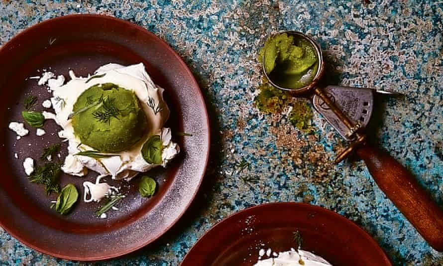 Photograph of Yotam Ottolenghi’s meringue nests with apple and celery sorbet and fresh herbs