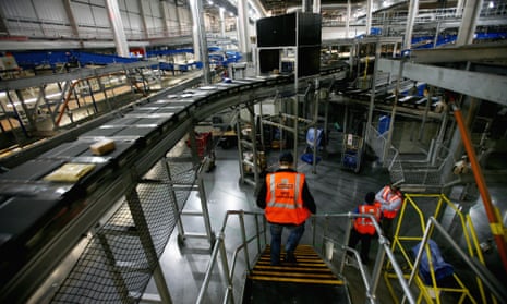 Packages move along a conveyor belts at Royal Mail's international distribution hub near Heathrow.