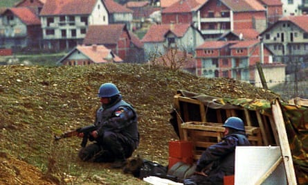 Serbian policemen take their position near the village Doneje Prekaze in the Serbian province of Kosovo, 1998.