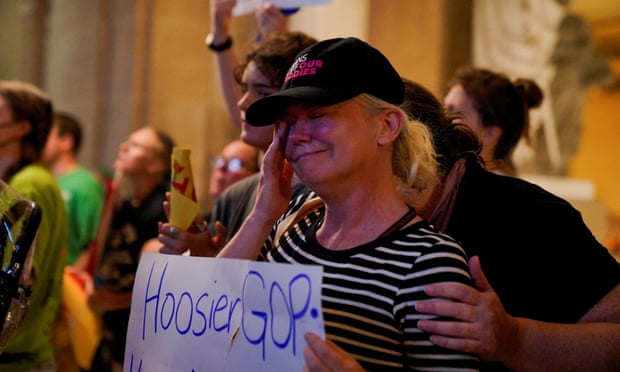 An abortion rights protester becomes emotional as the vote to ban most abortions passes the Indiana legislature on Friday.