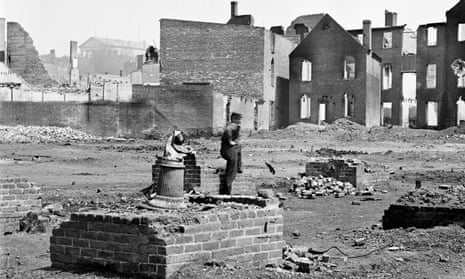 A Confederate soldier stands among the ruins of Richmond, Virginia at the end of the civil war.