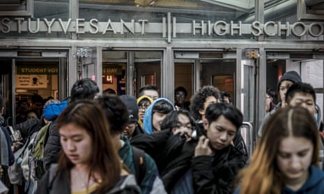 Students at Stuyvesant High School leave after classes end for the week, Friday. Mayor Bill de Blasio has been reluctant to close the school system because of the consequences for students and families. 