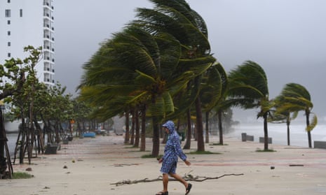 A person walks along the beach following the passage of Typhoon Noru in Da Nang, Vietnam