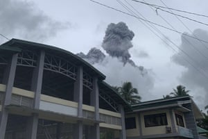 Ash and steam spew from Mount Bulusan in the sky over Casiguran