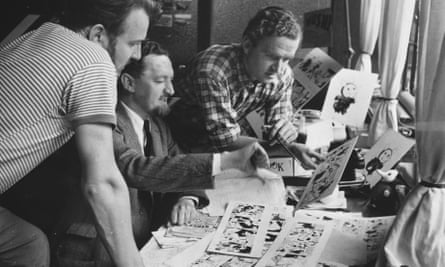 Wally Fawkes, right, checking sketches for the Flook strip with Daily Mail colleagues in 1951.