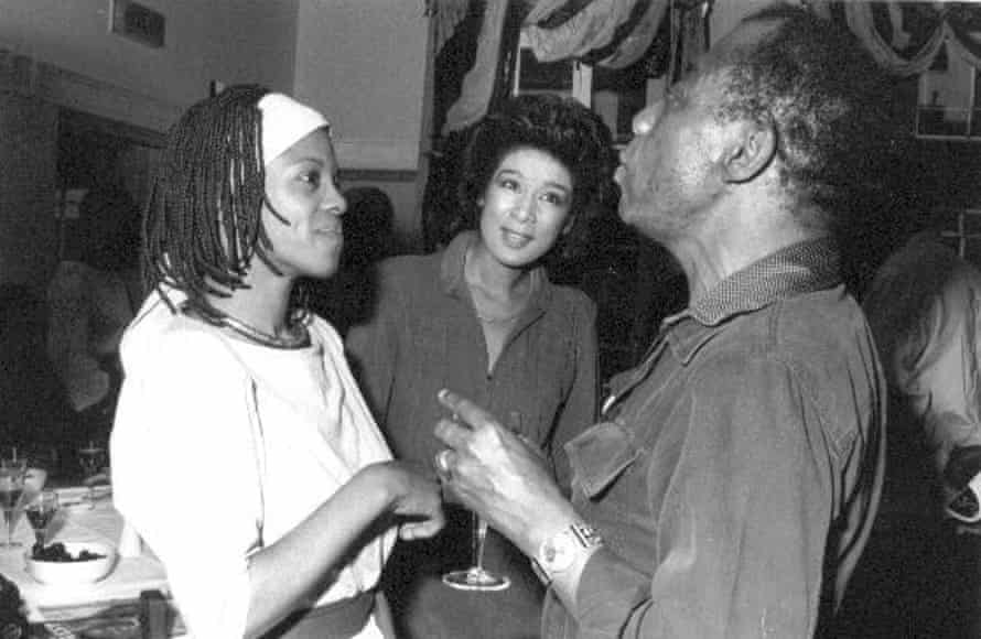 Busby (left) with the journalist Moira Stuart and the writer James Baldwin