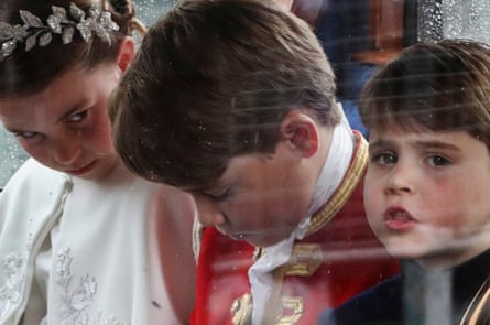 Prince George, Princess Charlotte and Prince Louis sit in a coach following the coronation.