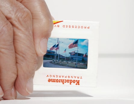 a closeup of a hand holding a Kodachrome slide