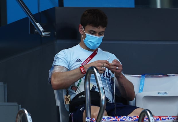 Tom Daley knitting in the stands at Tokyo 2020