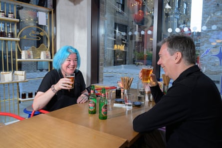 Cushla and Martin chat across a restaurant table