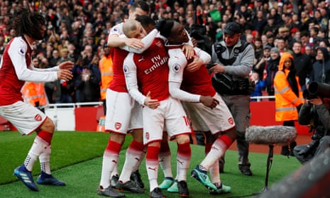 Arsenal’s Danny Welbeck celebrates scoring their third goal with teammates.