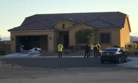 Police personnel stand outside the home of Stephen Paddock.