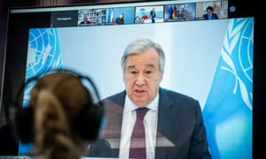 Antonio Guterres is seen on a screen during the video conference of the Petersberg Climate Dialogue in Berlin.