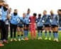 Kerstin Casparij talks to her Manchester City teammates before the Women's Super League match against Aston Villa.