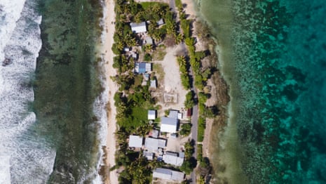 Homes on a narrow strip of land with ocean on both sides