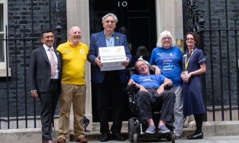 The actor Jim Carter and others handing a petition to Downing Street in 2019 urging a law change to enable more terminally ill people to get quicker access to benefits