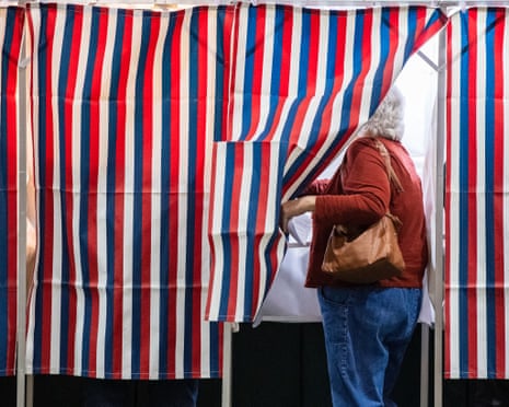 Person steps into voting booth
