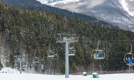 Chair lift on over the snowy forest at Abetone