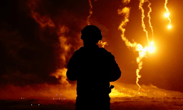 A Taiwan military personnel observes artillery hitting targets during a joint combat training Exercises in Pingtung county, Taiwan, 6 September 2022.