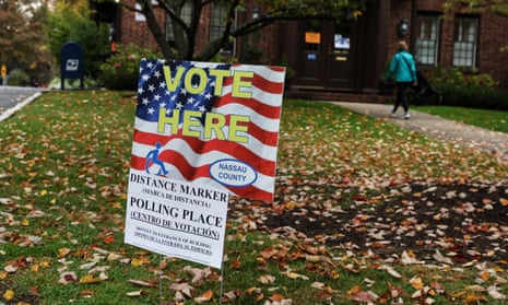 A woman walks into the Plandome Village Hall polling place in Plandome, Long Island, New York today.