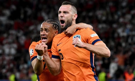 Netherlands' Stefan de Vrij celebrates scoring their equaliser with Xavi Simons.