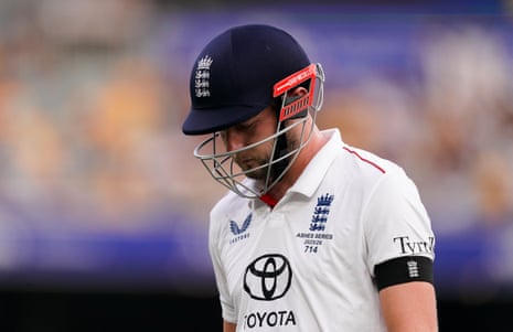 Gus Atkinson walks off dejected .