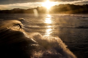 San Sebastian, Spain: a surfer off Ondarreta beach is seen at dawn