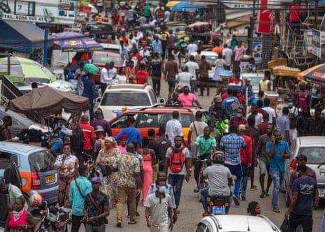A crowd of people go about their business at Accra’s Kwame Nkrumah Circle after the three-week-old partial lockdown in parts of Ghana is lifted, on 20 April.