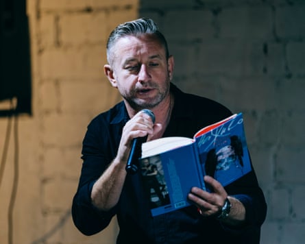 Serhii Zhadan reads a debut book by Yulia Paevska, call-sign ‘Taira’, at a poetry festival in Kharkiv last year. They are both serving in the Khartia brigade.