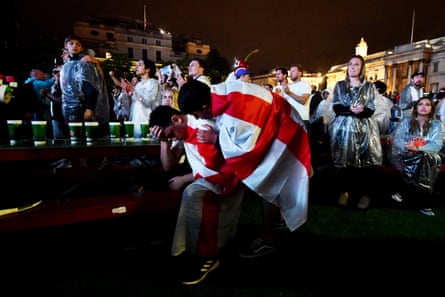 Fans watch England v Italy in Trafalgar Square.