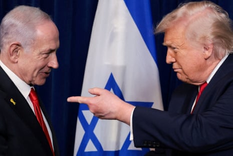 Donald Trump points his finger towards Benjamin Netanyahu during a press conference.