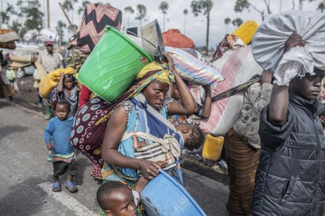 People fleeing the fighting between government forces and M-23 rebels make their way towards Goma, Democratic Republic of Congo,November 2022. 
