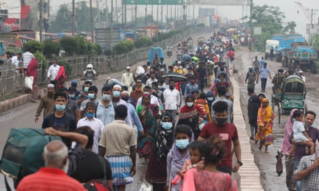 People in Bangladesh walking to their destination as vehicles are stopped as authorities enforced a strict lockdown to combat a much deadlier second wave of the Covid-19 coronavirus infection in Dhaka.
