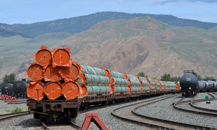 Steel pipe to be used in the pipeline construction of Canada’s Trans Mountain expansion project sits on rail cars at a stockpile site in Kamloops, British Columbia.