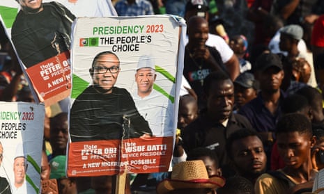 Labour party supporters hold placards depicting Peter Obi and his running mate Yusuf Datti Baba-Ahmed during a campaign rally at Adamasingba stadium in Ibadan, south-western Nigeria, on 23 November 2022